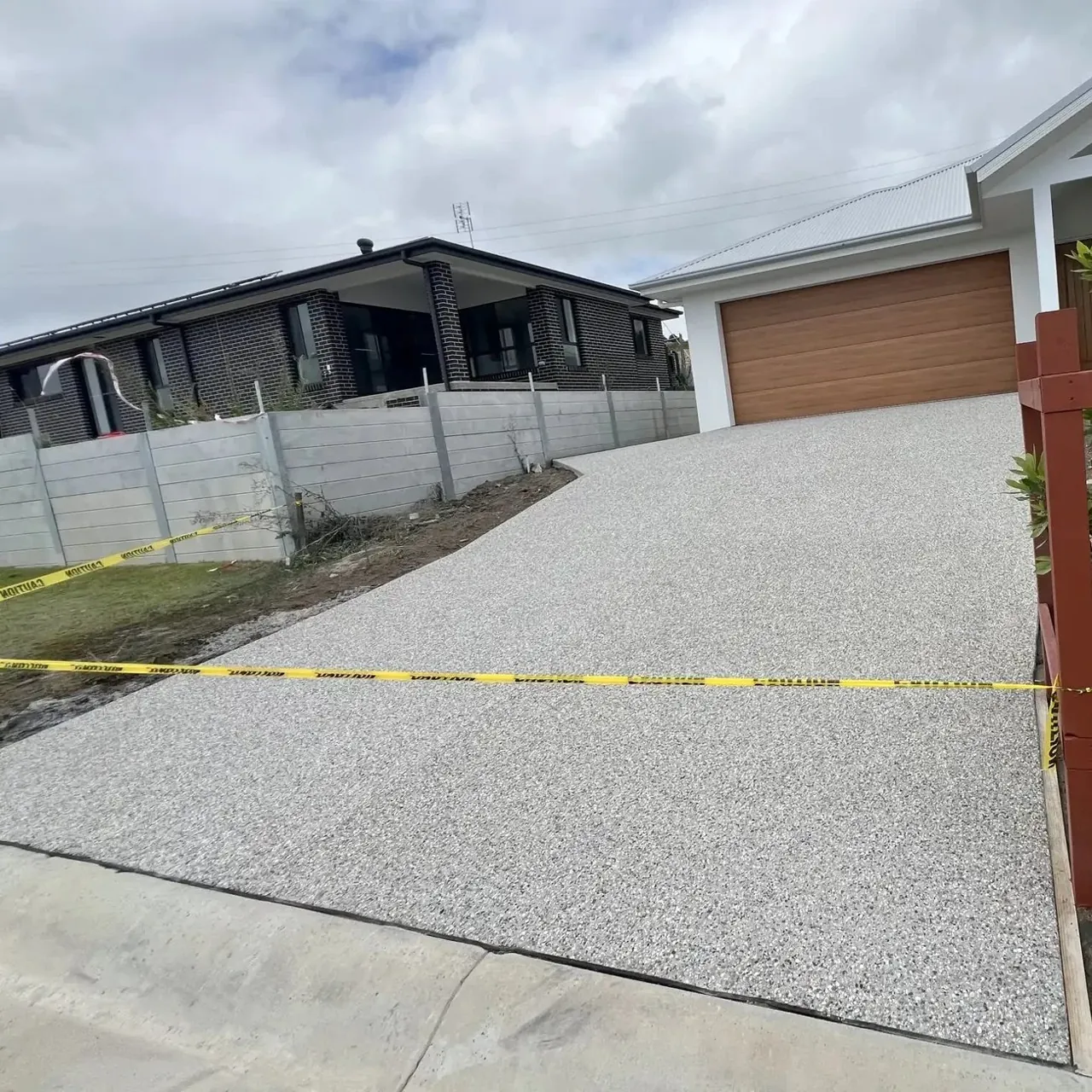 Wide exposed aggregate concrete driveway on the Central Coast