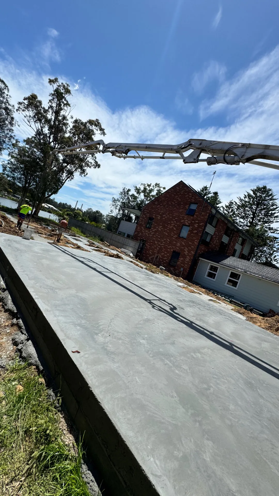Concrete pump truck pouring a new house slab on the Central Coast