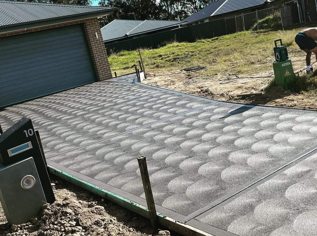 Concrete Driveway Central Coast with cove finish and Coloured Concrete